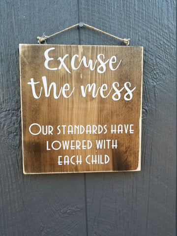 Excuse the mess.  Our standards gave lowered with each child... Wood sign